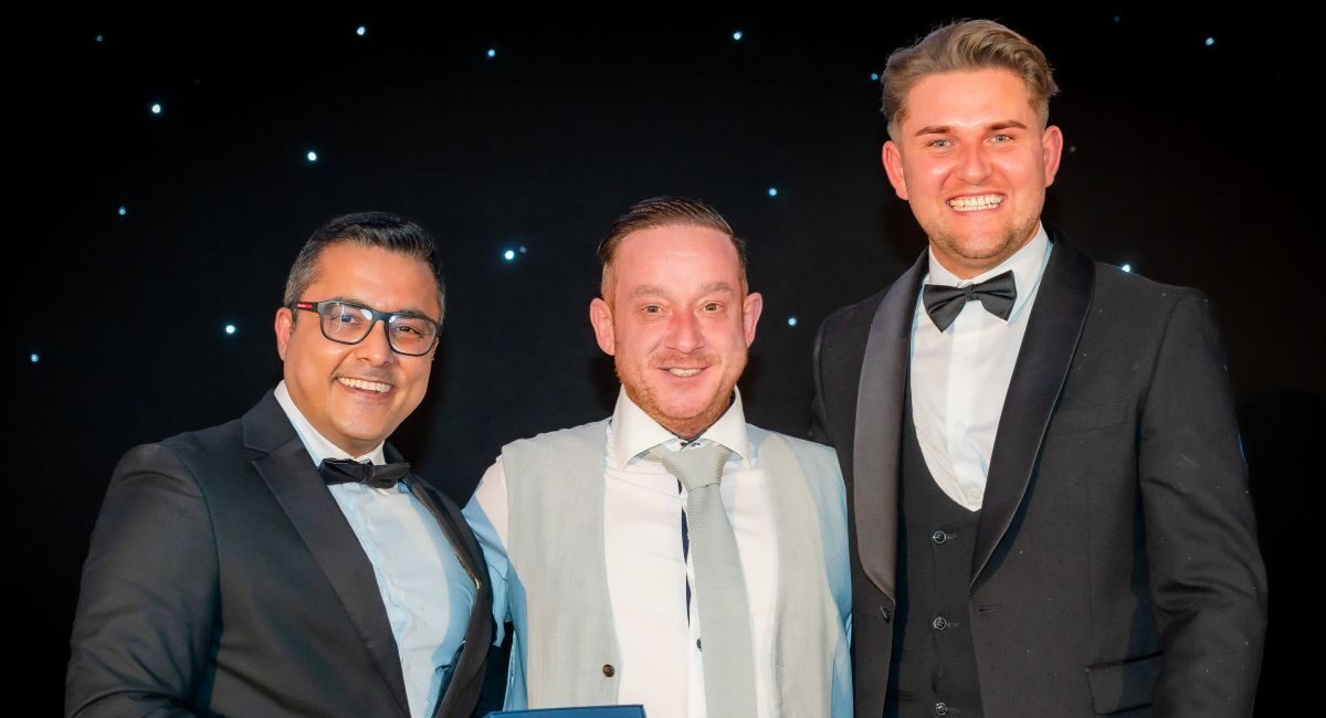 Trevor receiving his award